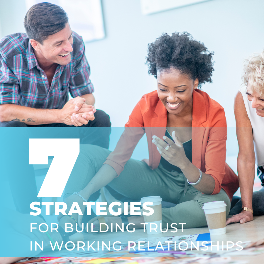 Three diverse professionals sitting and smiling together. Text below the photo reads 7 Strategies for Building Trust in Working Relationships
